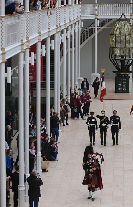 Soldiers of the Royal Scots Dragoon Guards marching the replica standard and eagle through the Grand Gallery. 