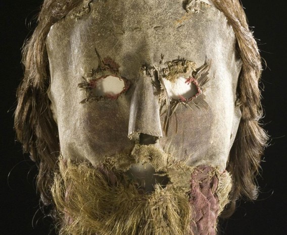 Closeup of Alexander Peden's mask. Resembles a human decaying human face with eye holes and real light brown hair with beard. 
