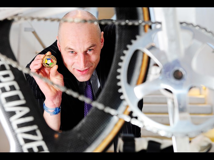 Graeme Obree with his 1993 World Hour Record medal, awarded by the Union Cycliste Internationale.