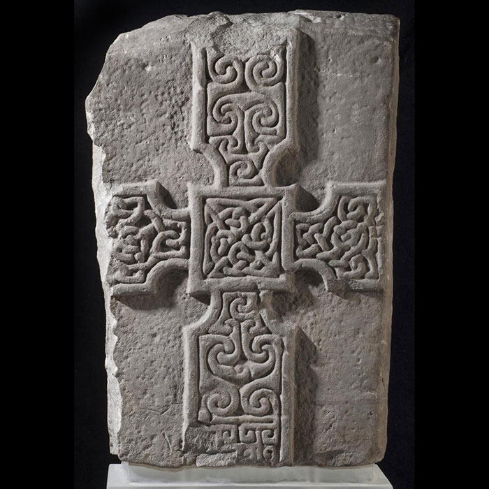 Slab of grey sandstone with a cross on one side. From Monifieth, Angus, Scotland, c. AD 700–800. 