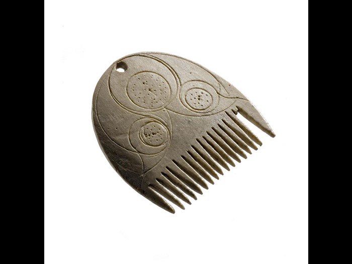 Comb made of bone, probably used to comb a beard or moustache, from Langbank Crannog, Renfrewshire, AD 1-200.