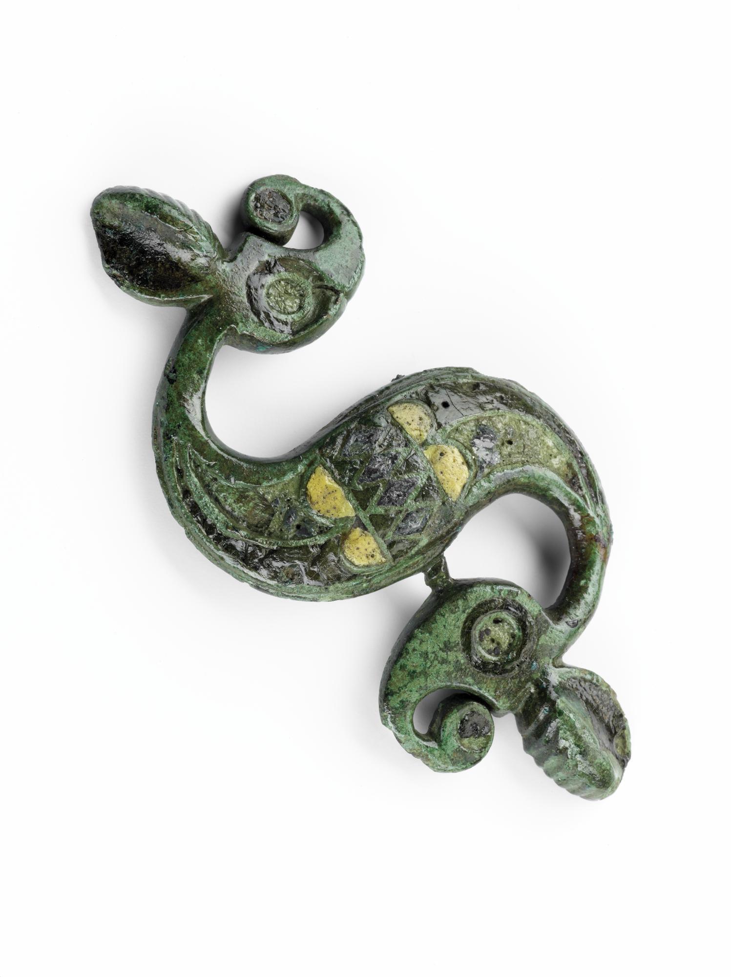 Image of Dragonesque fibula (brooch) of bronze, decorated with blue, red and yellow enamel, from the Roman site at Newstead © National Museums Scotland