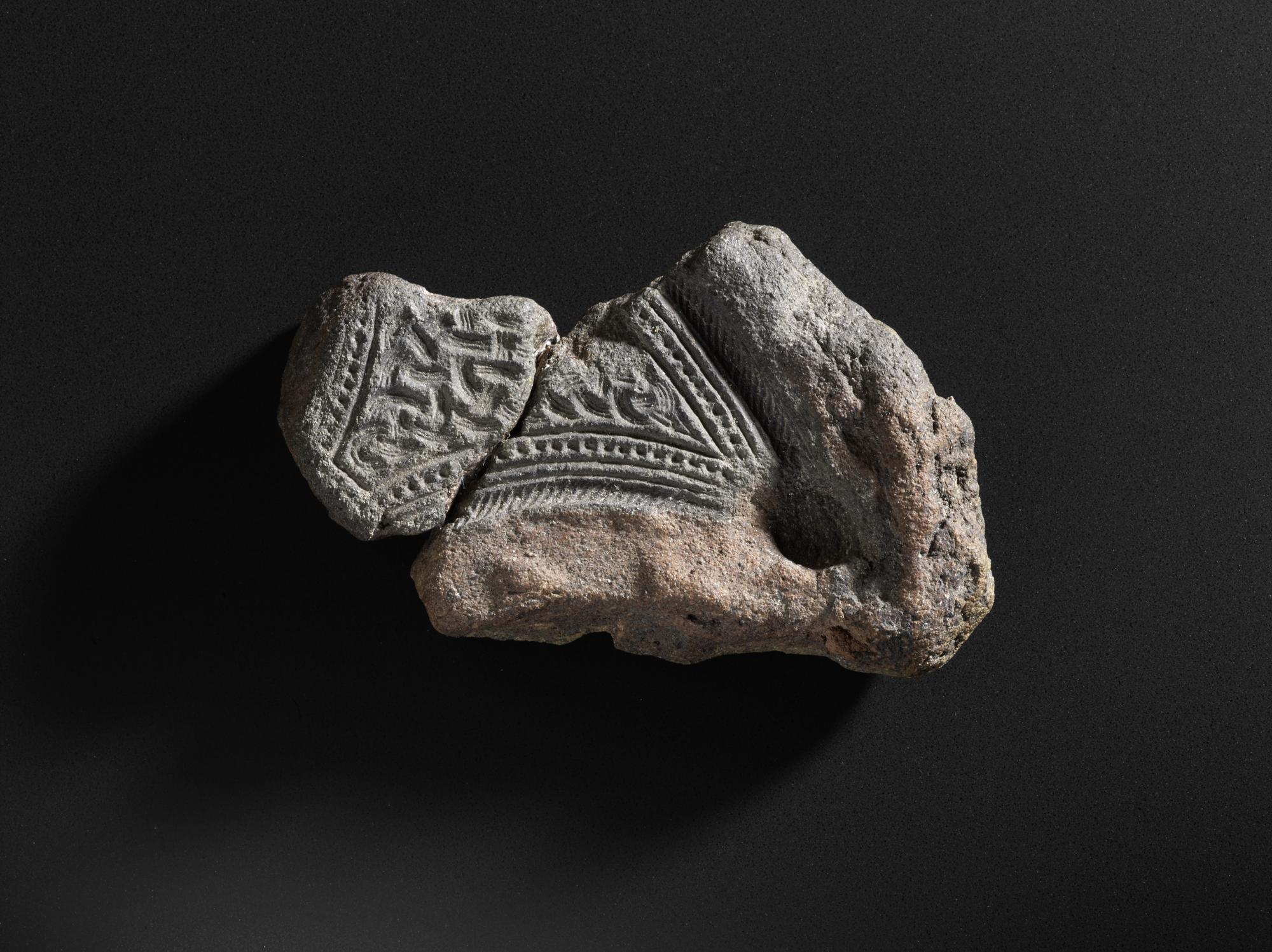 Image of Fragment of a mould for a decorated pennanular brooch, from Mote of Mark, Kirkcudbrightshire, 500 - 700 AD © National Museums Scotland