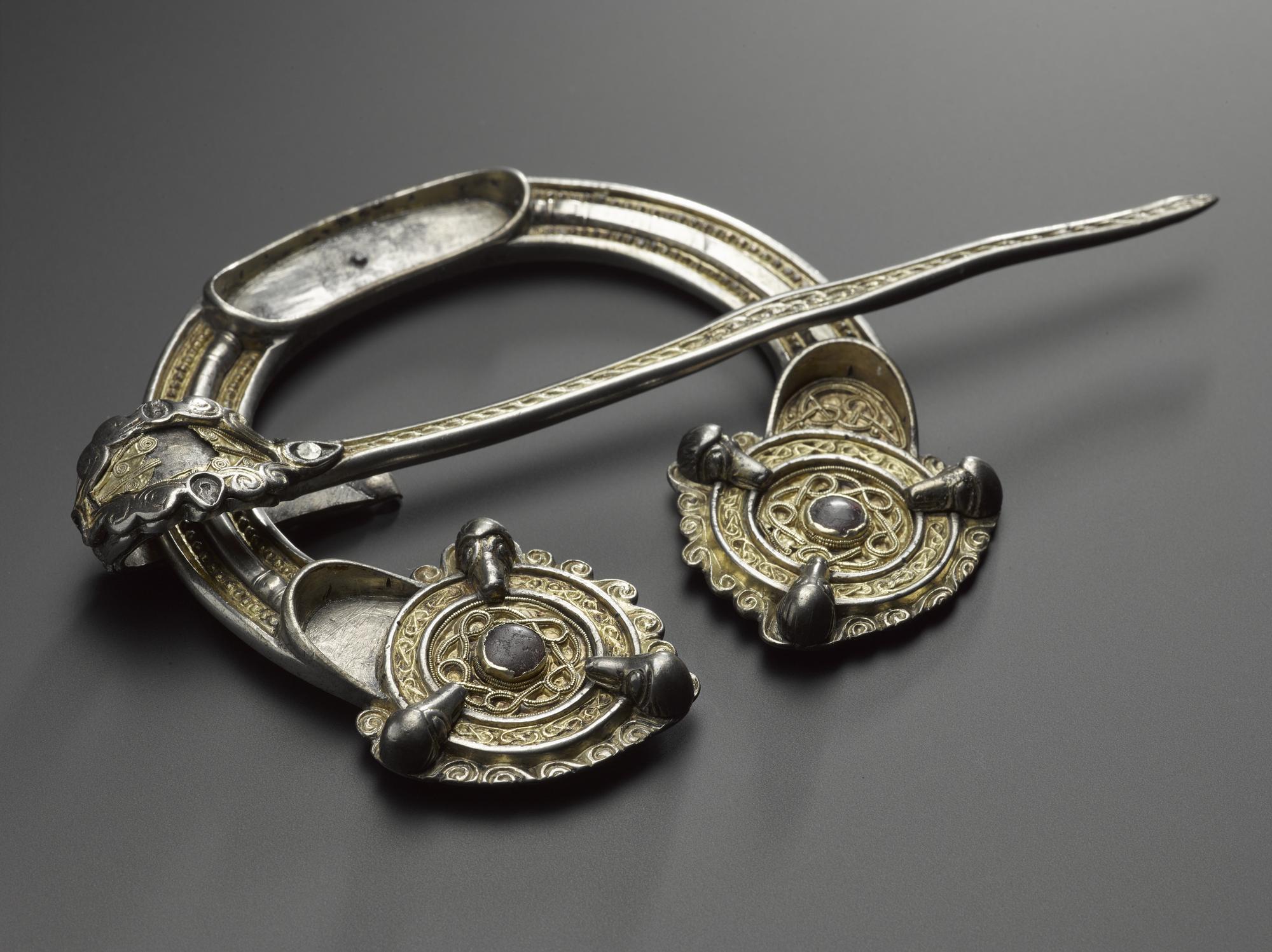Image of Silver penannular brooch, set with gold filigree, with spiral and zoomorphic decoration, Pictish, from near Clunie Castle, Dunkeld, Perthshire, 8th or 9th century © National Museums Scotland