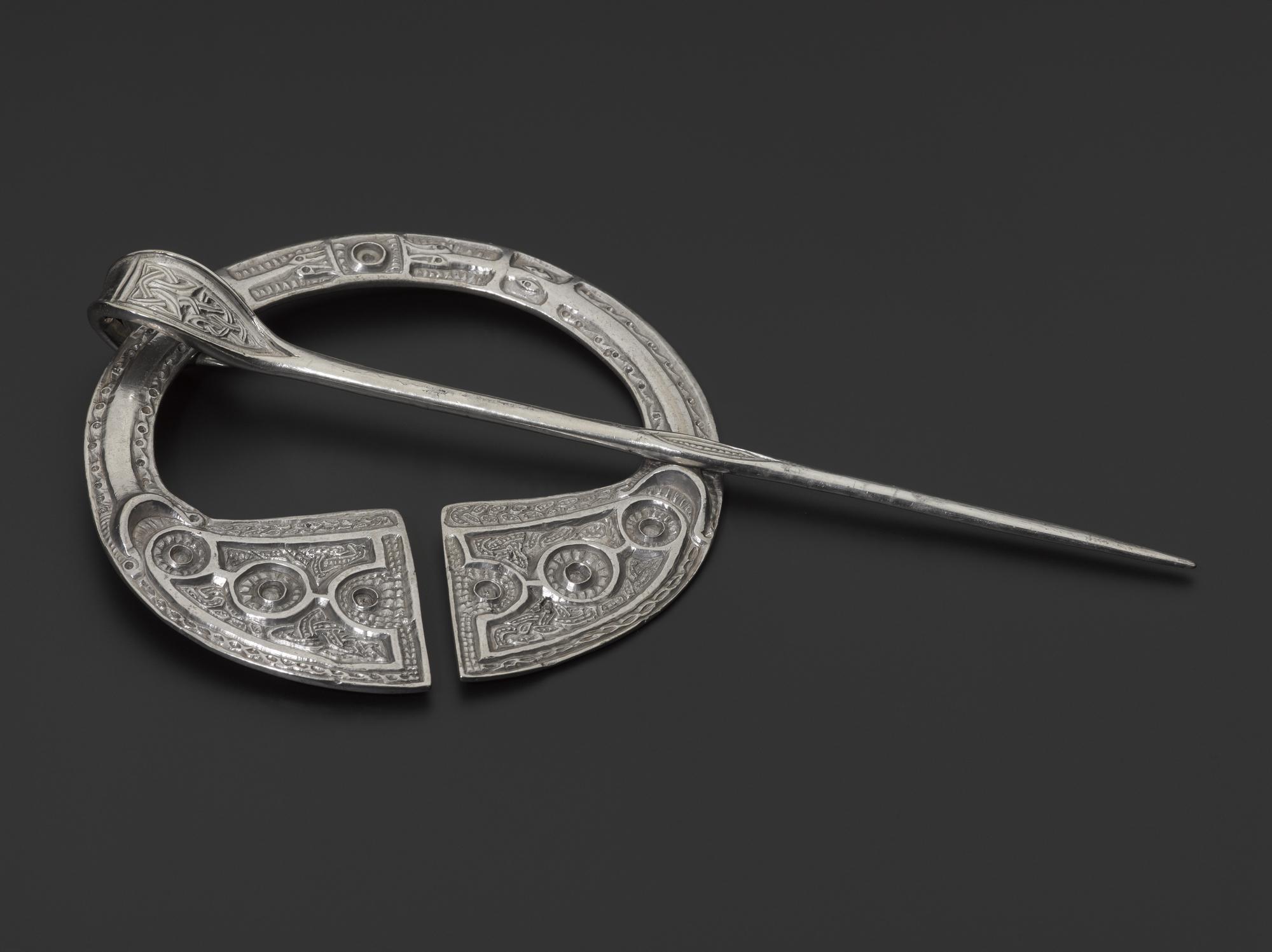 Image of Silver penannular brooch with spiral and zoomorphic decoration, Pictish, from near Clunie Castle, Dunkeld, Perthshire, 8th or 9th century © National Museums Scotland