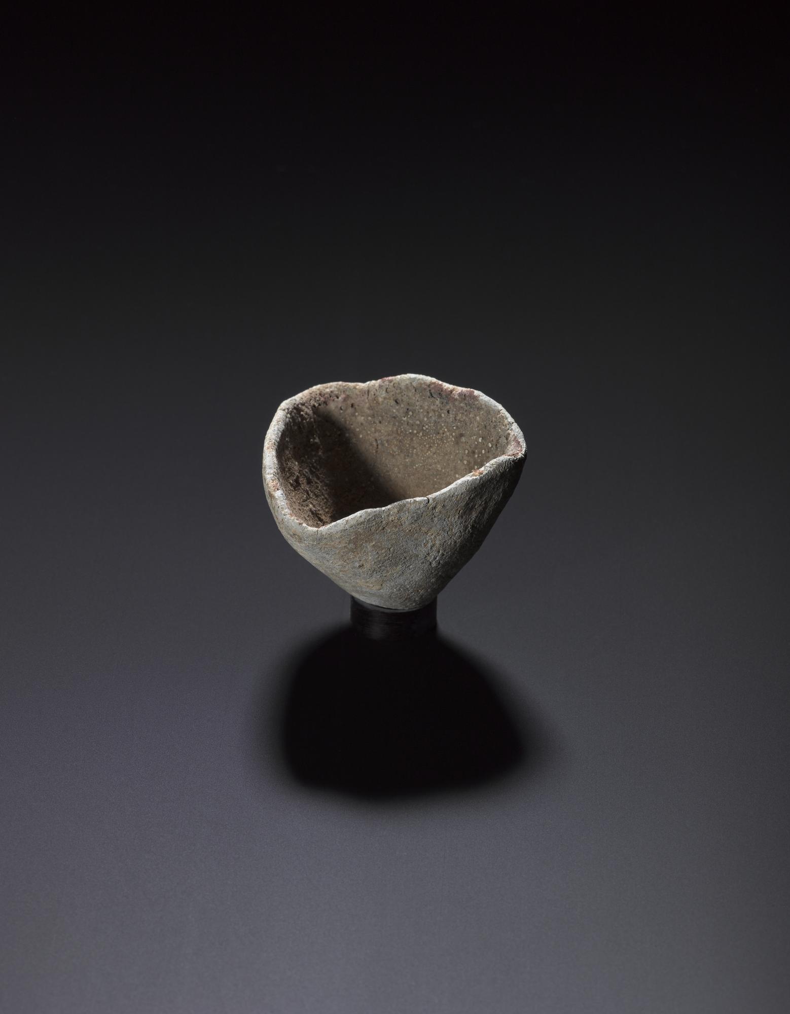 Image of Triangular crucible used for melting silver, from Traprain Law © National Museums Scotland