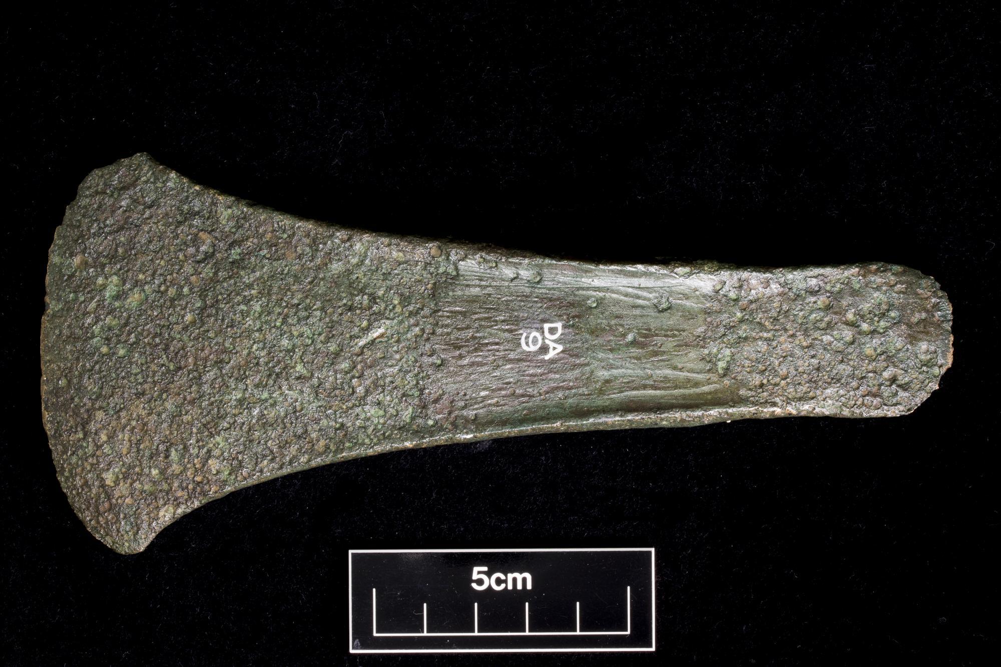 Image of Early Bronze Age developed flat axe, type Glenalla, from under a cairn in the Eildon Hills, Roxburghshire, 1950 - 1750 BC © National Museums Scotland