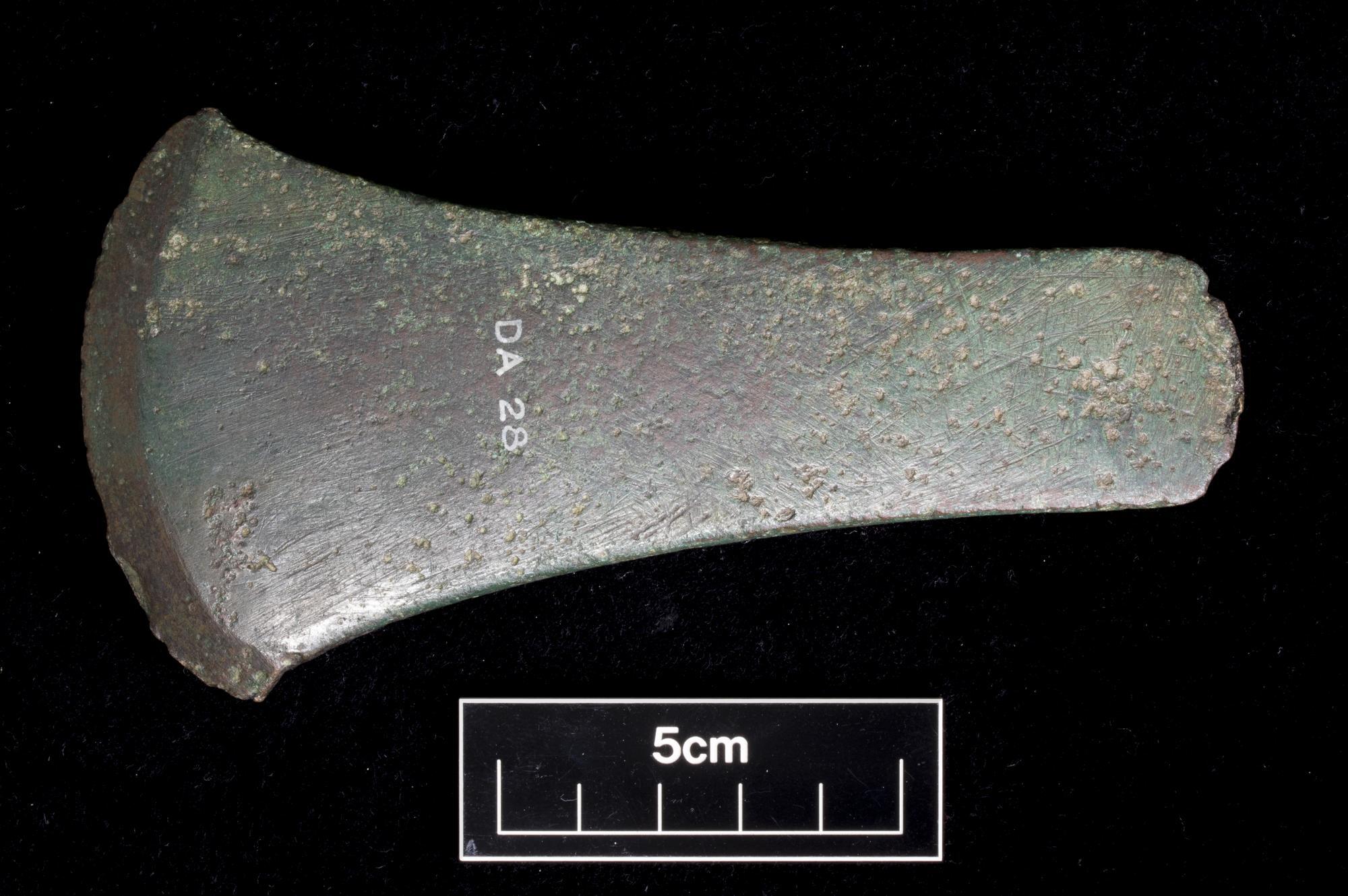Image of Early Bronze Age flat axe, type Migdale, one of two axes possibly found together with "ferrule-like" objects while ploughing, cists were seemingly also disrupted at the same time, the association is uncertain, from Camptown, Haddington, East Lothian, 2150 - 1950 BC © National Museums Scotland