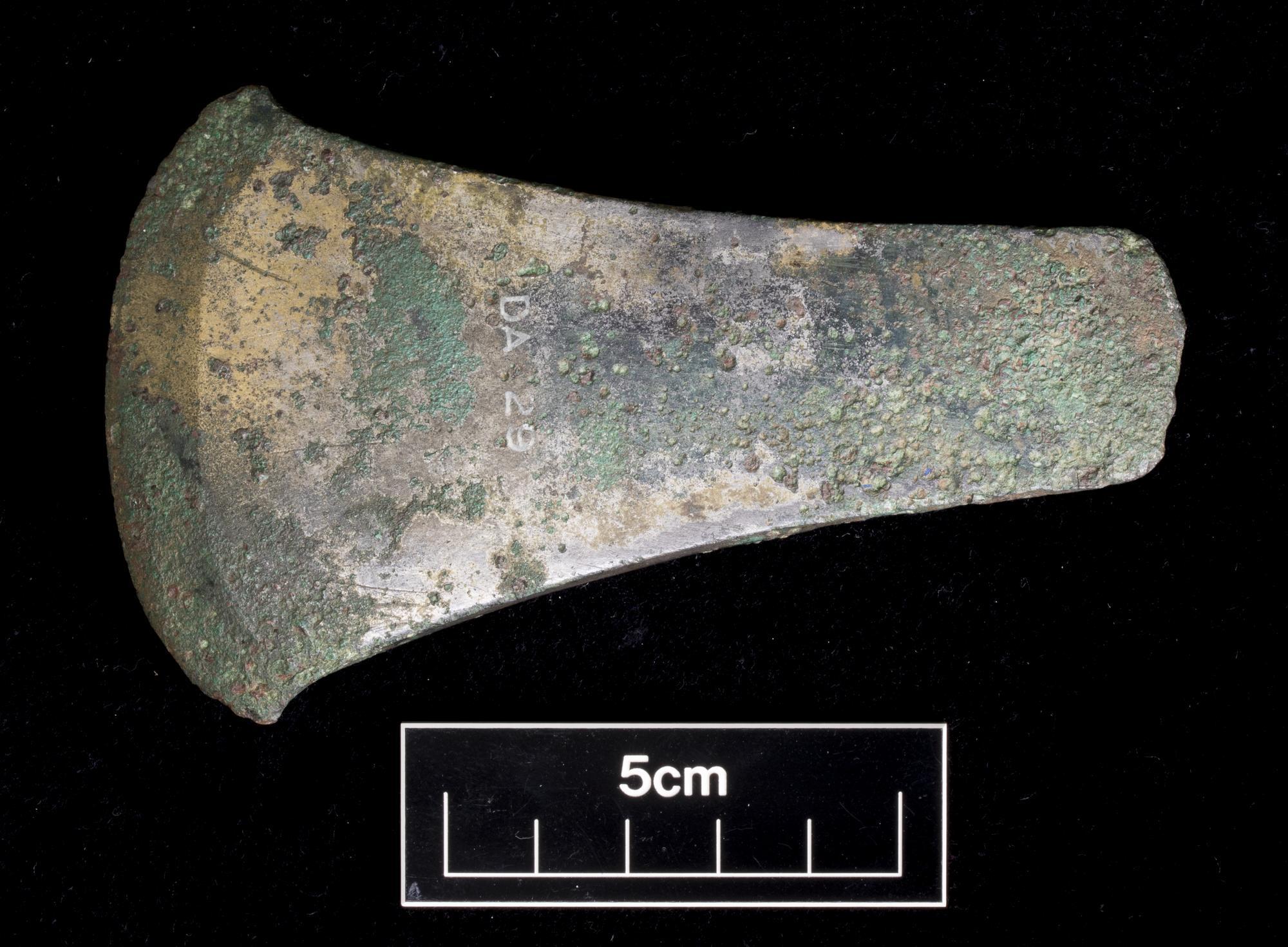 Image of Early Bronze Age flat axe, type Dunnottar, one of two axes possibly found together with "ferrule-like" objects while ploughing, cists were seemingly also disrupted at the same time, the association is uncertain, from Camptown, Haddington, East Lothian, 2150 - 1950 BC © National Museums Scotland