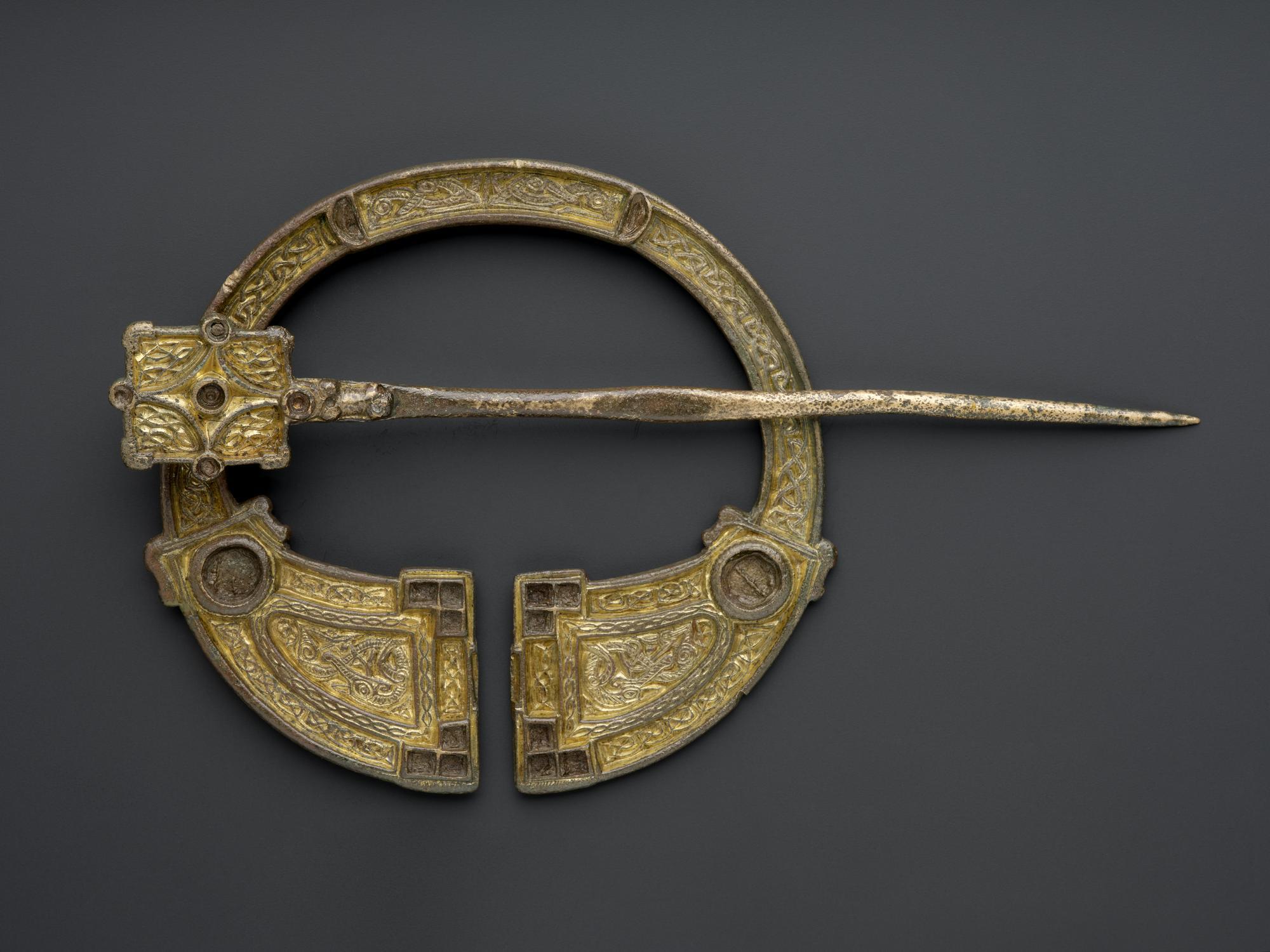 Image of Brooch of gilt bronze, penannular with interlaced ornament, from Mull, 700 - 800 AD © National Museums Scotland