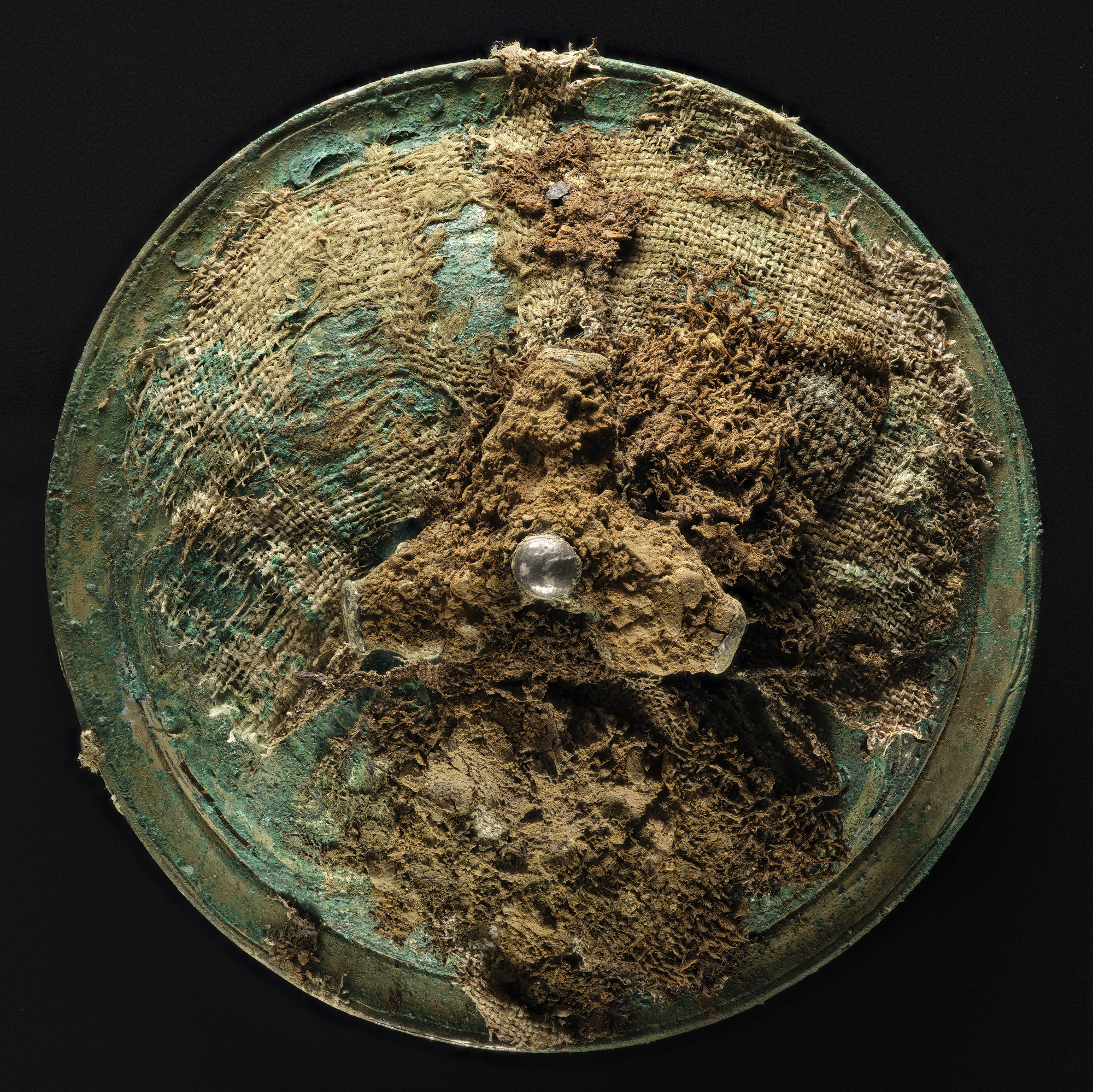Image of Vessel wrapped in layers of textiles, from the Viking age Galloway Hoard © National Museums Scotland