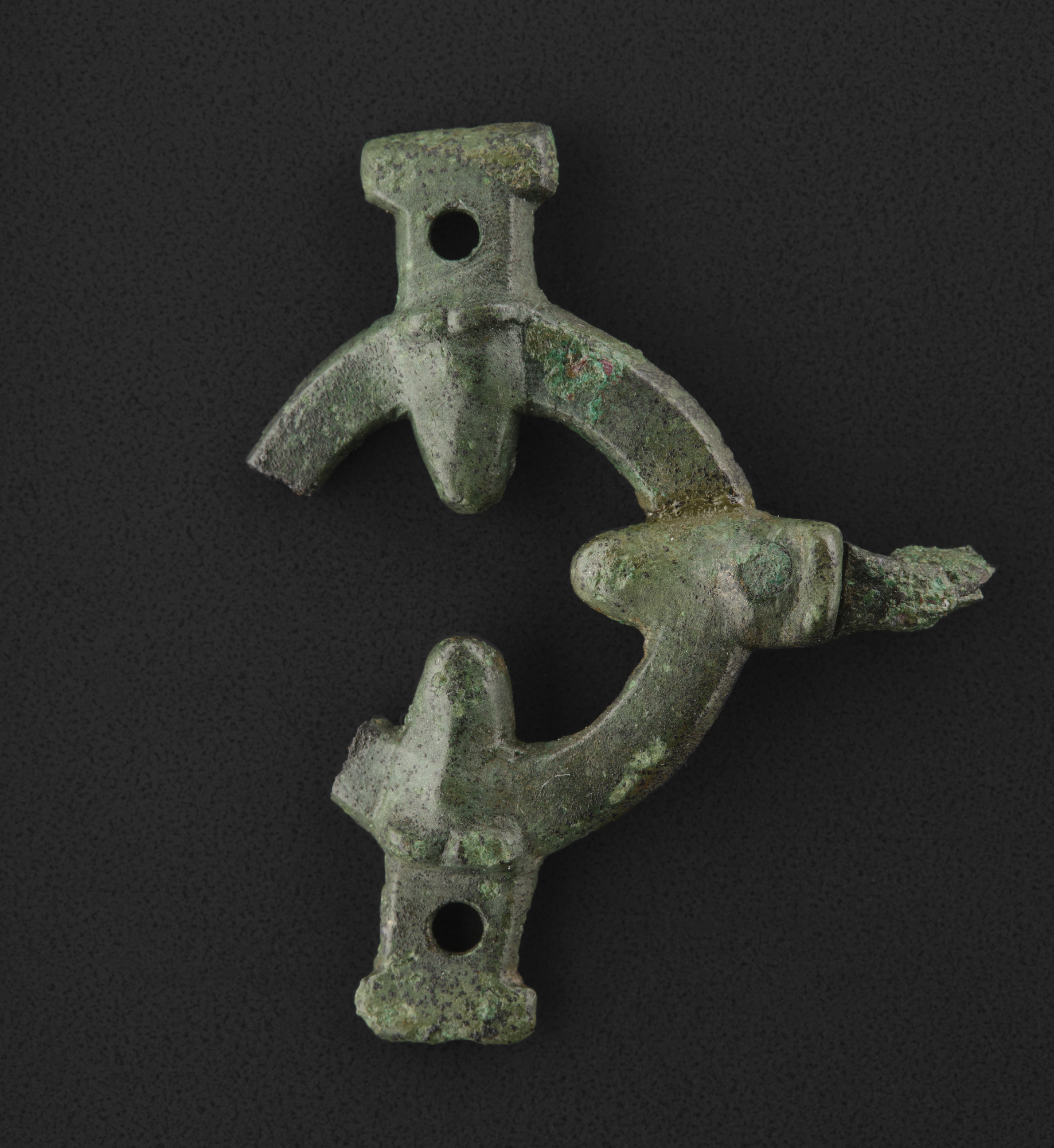 Image of Two conjoining pieces of a circular bucket mount, now conjoined, from Kildonnan, Eigg © National Museums Scotland