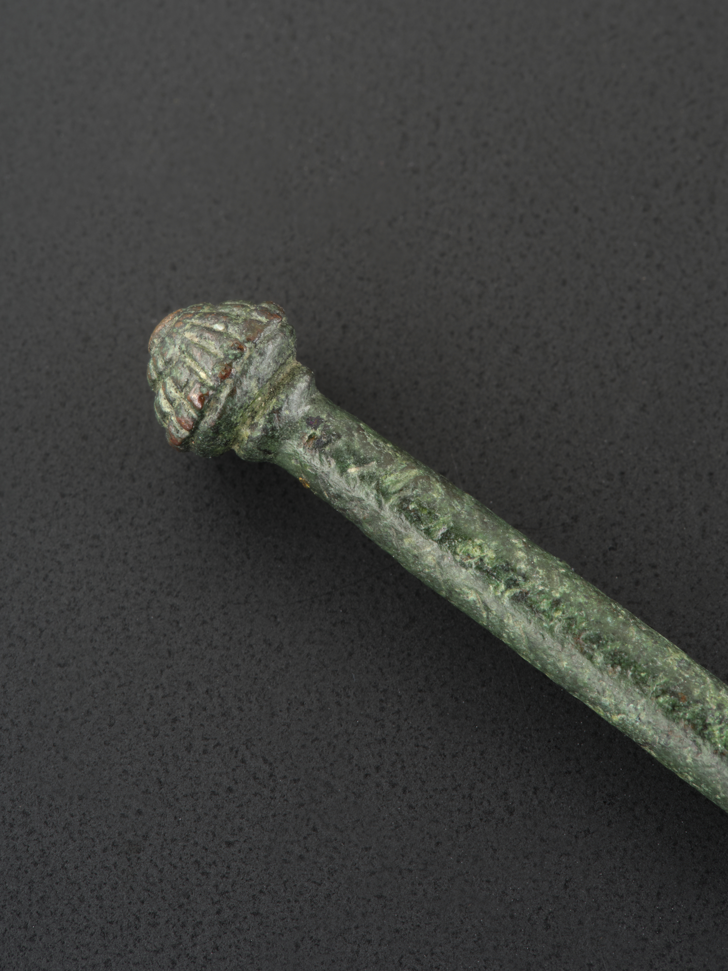 Image of Pin of copper alloy, with a conical head and incised lines, from Tiree, Argyll © National Museums Scotland