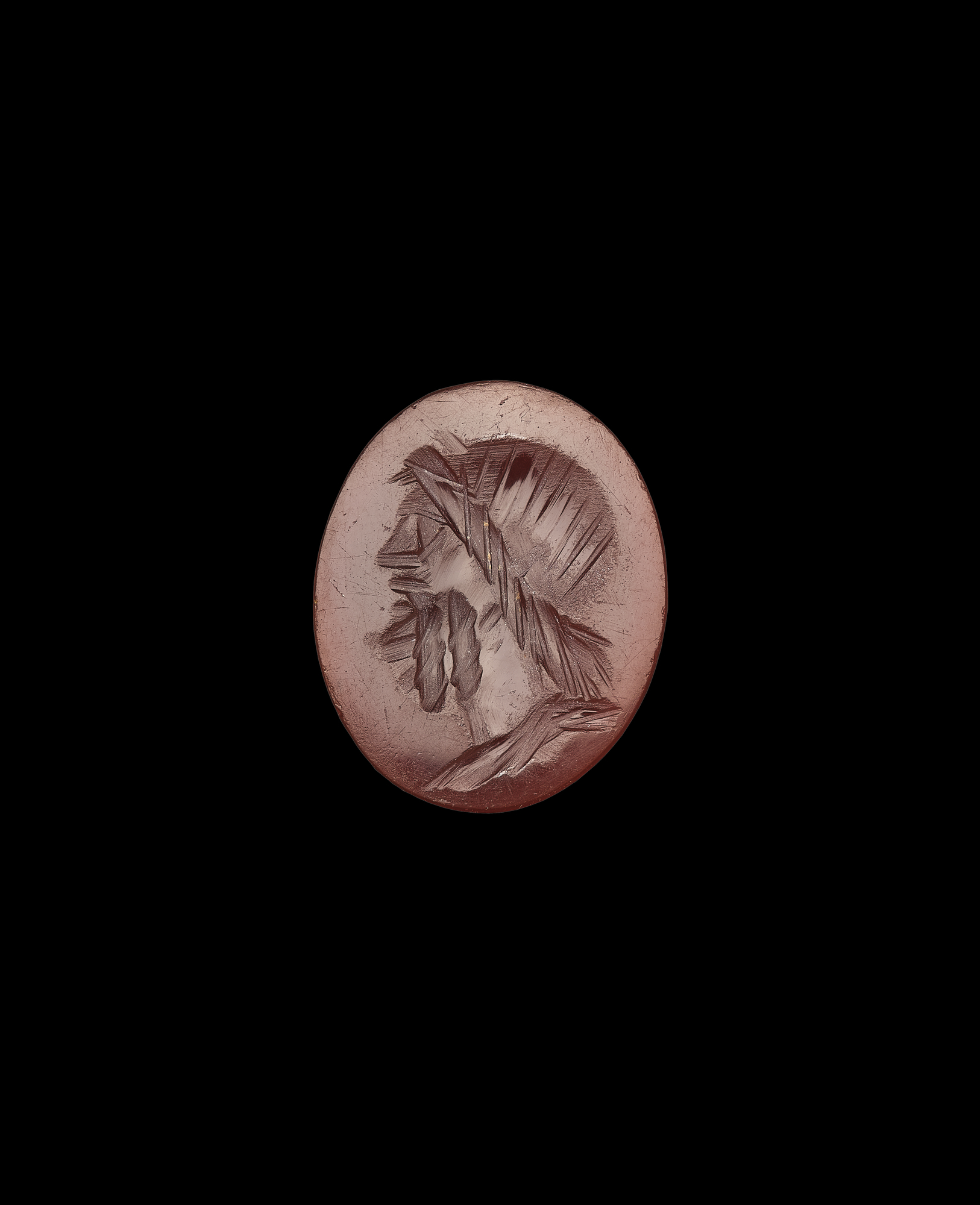Image of Cornelian intaglio depicting bust of Jupiter, classicizing style of 1st century AD, part of the Cruickshank collection of finds from Newstead, Roxburghshire © National Museums Scotland