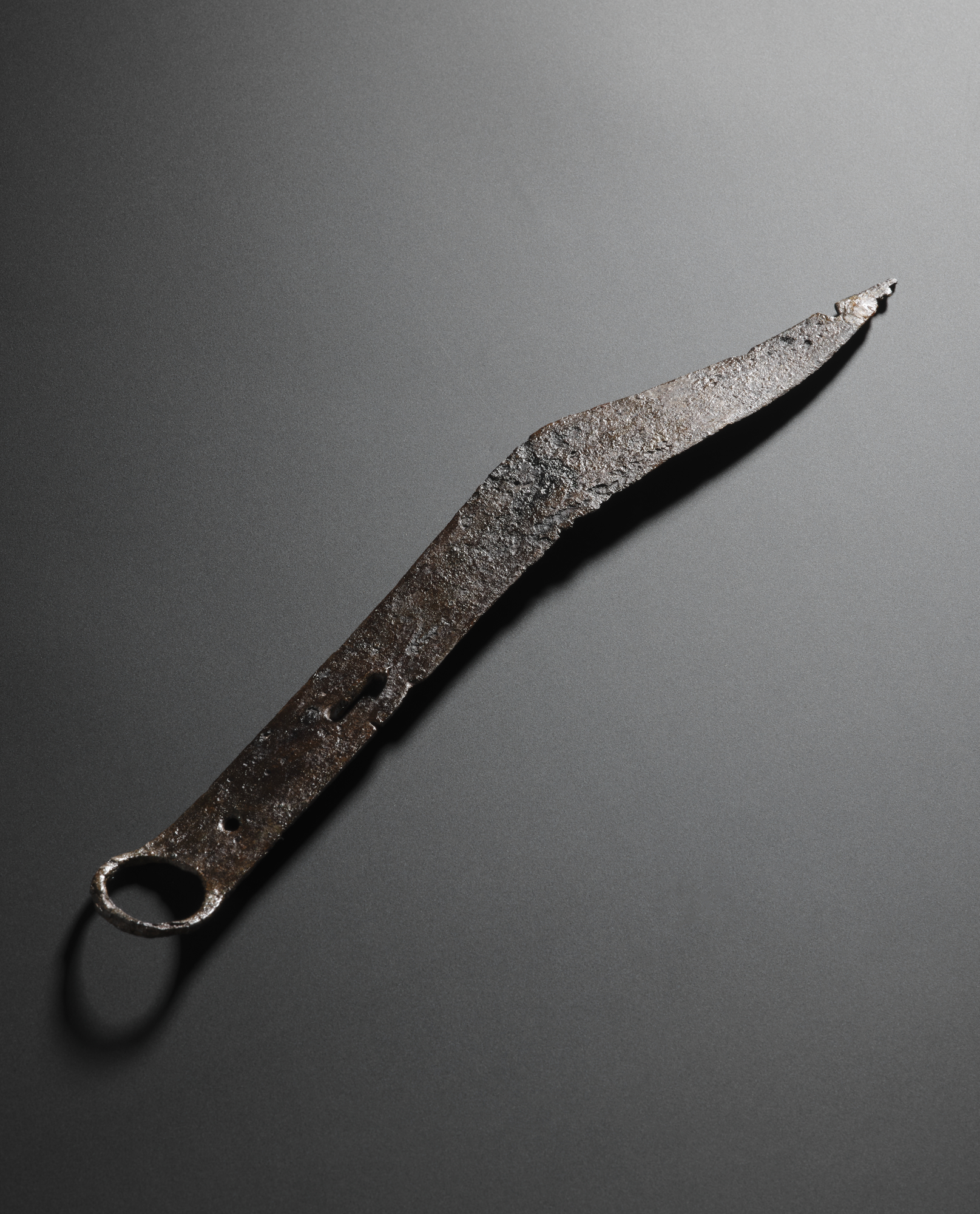 Image of Iron knife with a ring for suspension at the end, from the Roman site at Newstead © National Museums Scotland