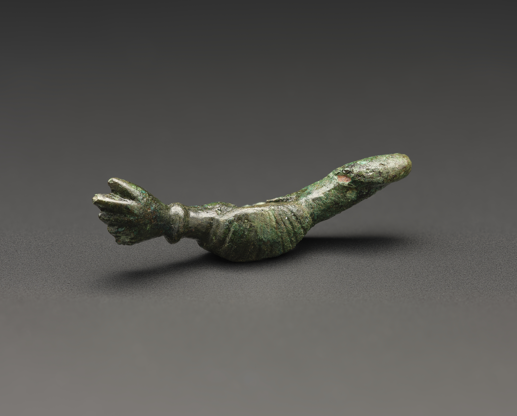 Image of Bronze amulet with phallic symbol, from the Roman site at Newstead © National Museums Scotland