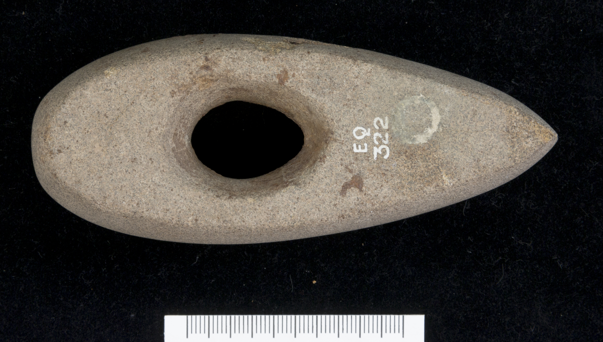 Image of Stone battle axe, possibly of greenstone, with oval perforation, from Hagg Wood, Foulden, Berwickshire © National Museums Scotland