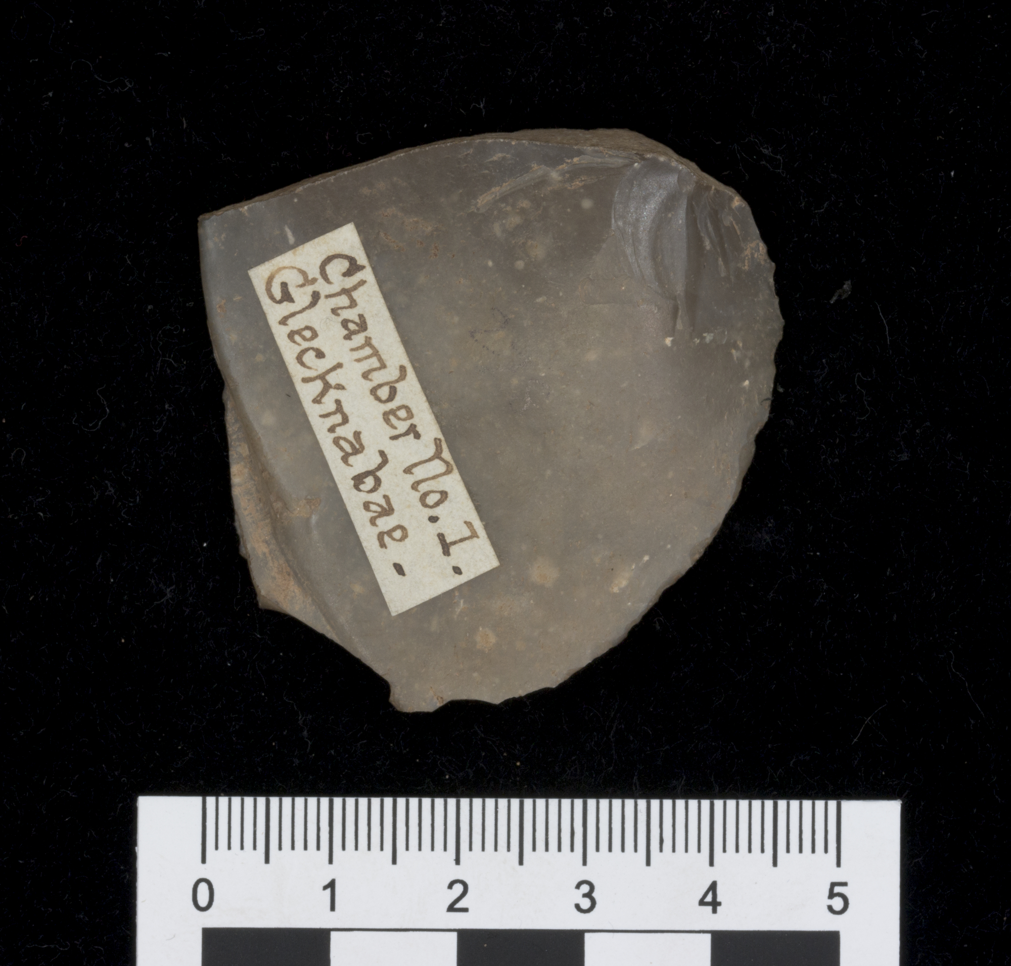 Image of Oval knife-like flake of brown flint, from Chamber No. I at Glecknabae, Bute © National Museums Scotland