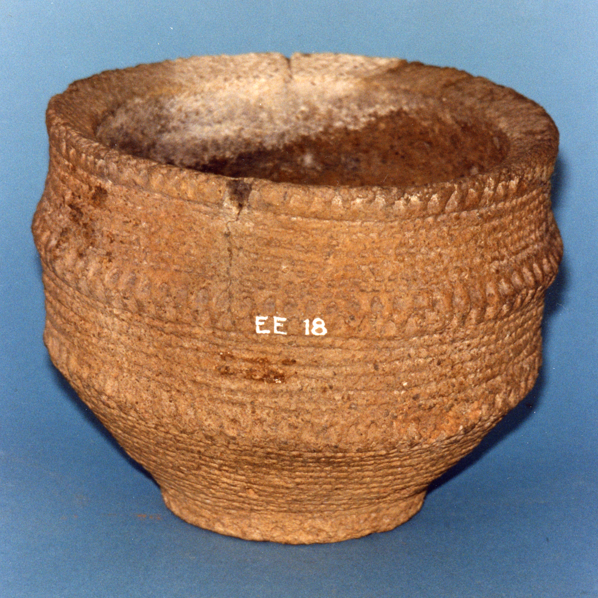 Image of Food vessel with parallel lines of impressed ornament and triangular indentations, found at Chlendry Farm, Lochinch, Wigtownshire, Early Bronze Age, 2200 - 1650 BC © National Museums Scotland