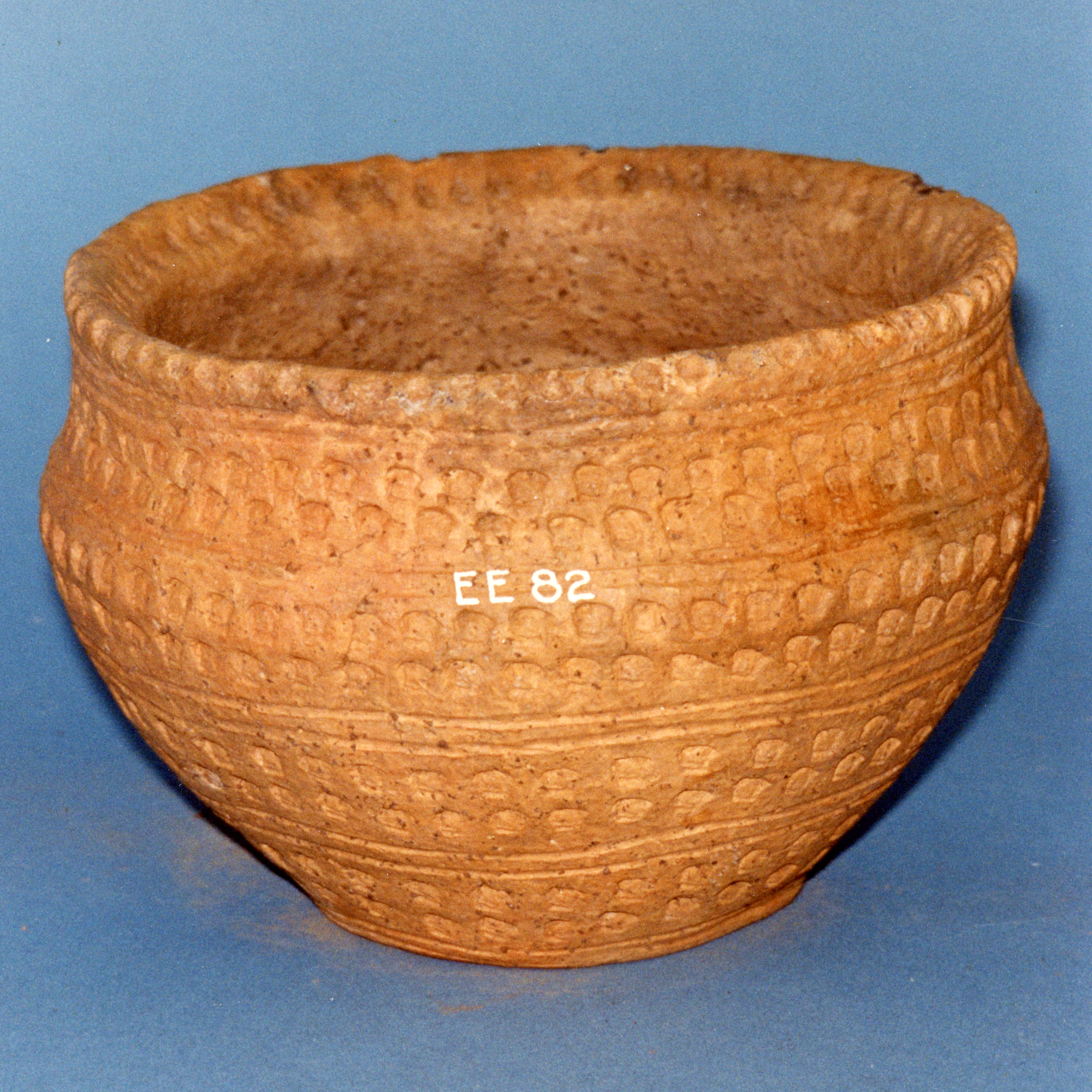 Image of Pottery food vessel with eight rows of square notches on body, from a cist at Duncra Hill, Pencaitland, East Lothian © National Museums Scotland
