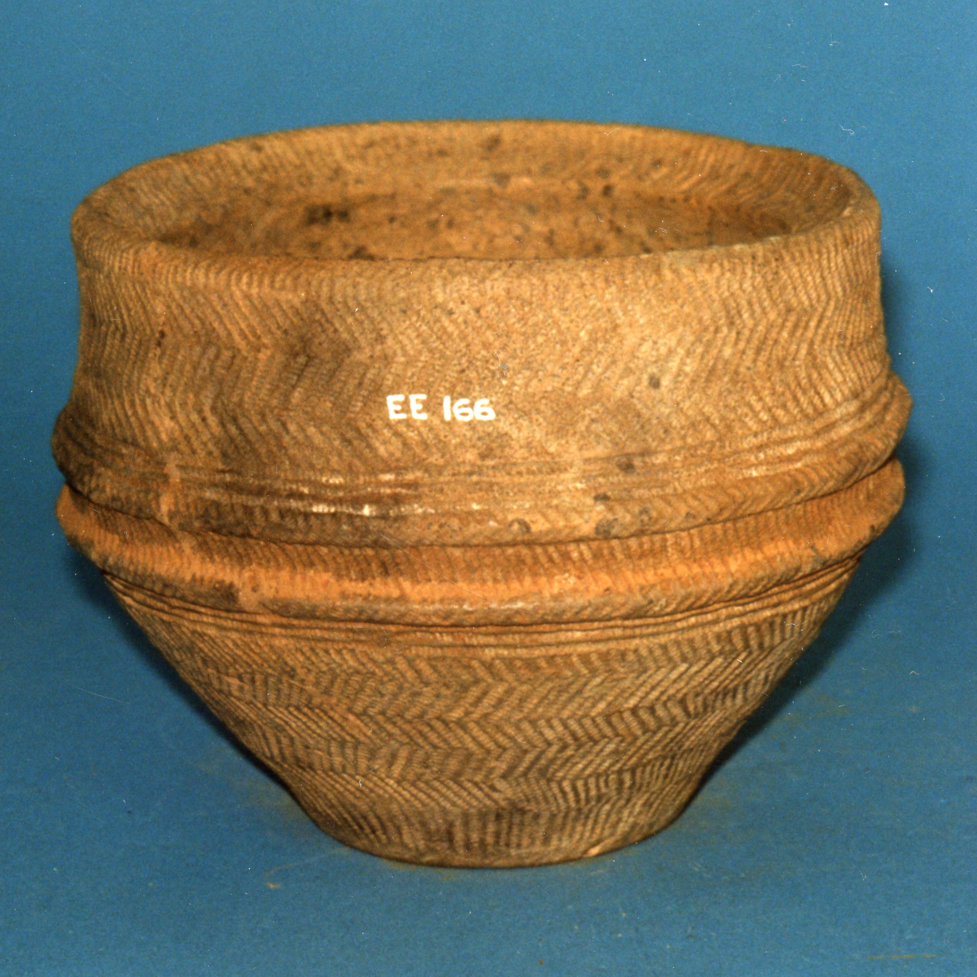 Image of Pottery food vessel decorated with neat herringbone bands of whipped cord, from Denovan, Stirlingshire © National Museums Scotland