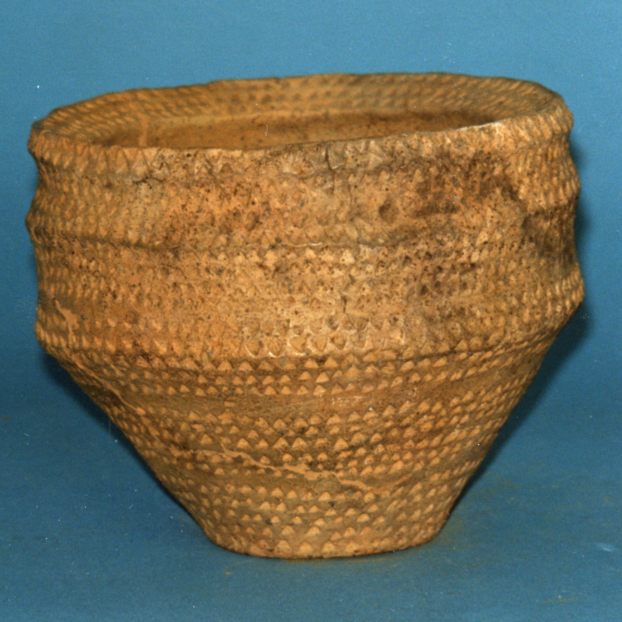 Image of Tripartite vase food vessel decorated with triangular punch marks in horizontal rows, from Denovan, Stirlingshire, 2300 - 1700 BC © National Museums Scotland
