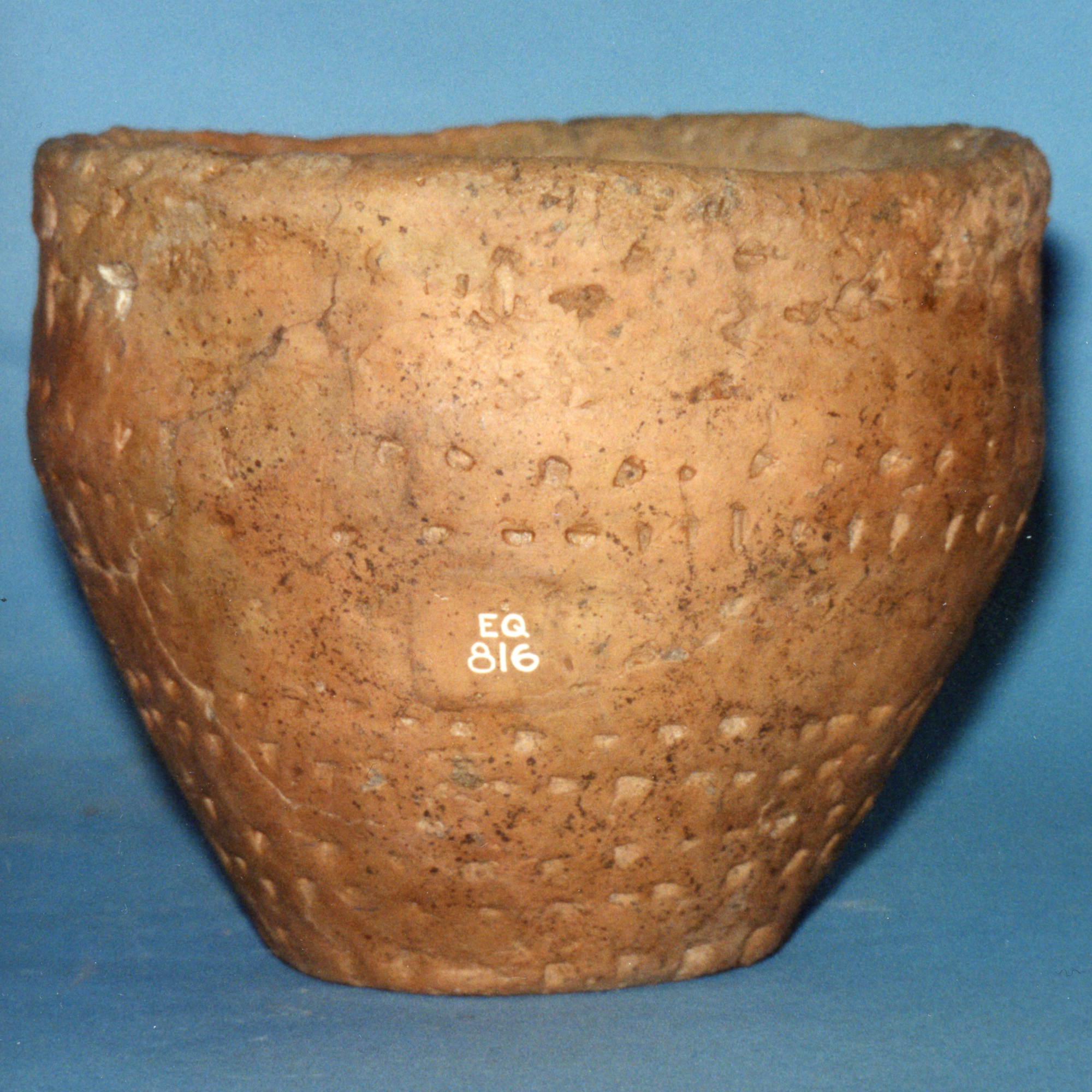 Image of Vase-shaped pottery food vessel decorated all over with jabbed impressions, from Almondbank, Perth © National Museums Scotland