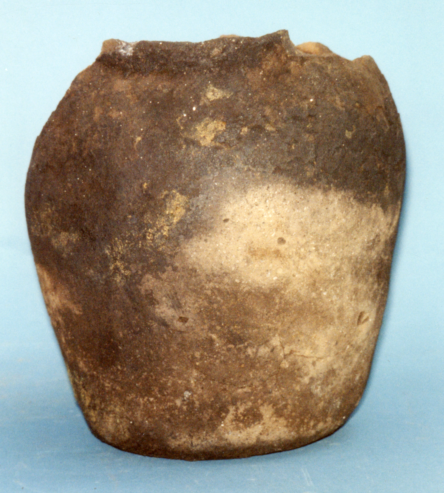 Image of Pottery vessel, nearly complete, with organic deposits on the external surface, found in a peat bank at Camus-a-Bhualta, Harris © National Museums Scotland
