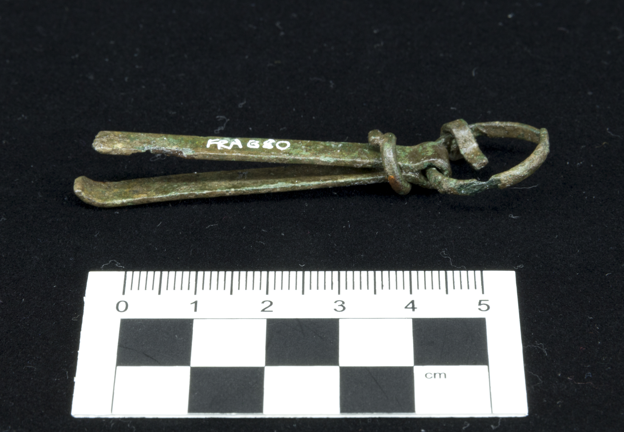 Image of Pair of tweezers on a ring, from the Roman site at Newstead © National Museums Scotland