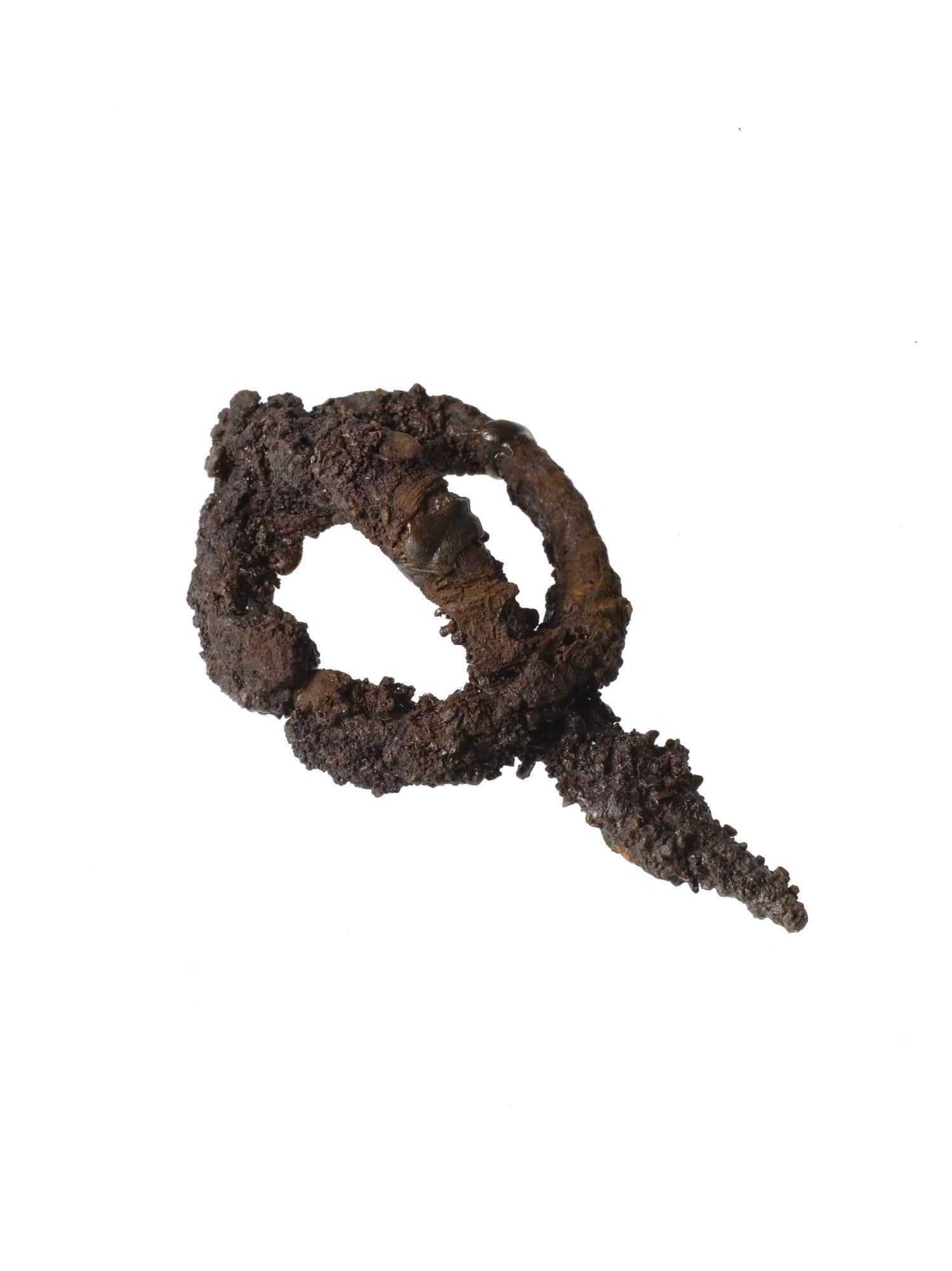 Image of Iron brooch with very faint textile remains, found in a cist at Craigie © National Museums Scotland