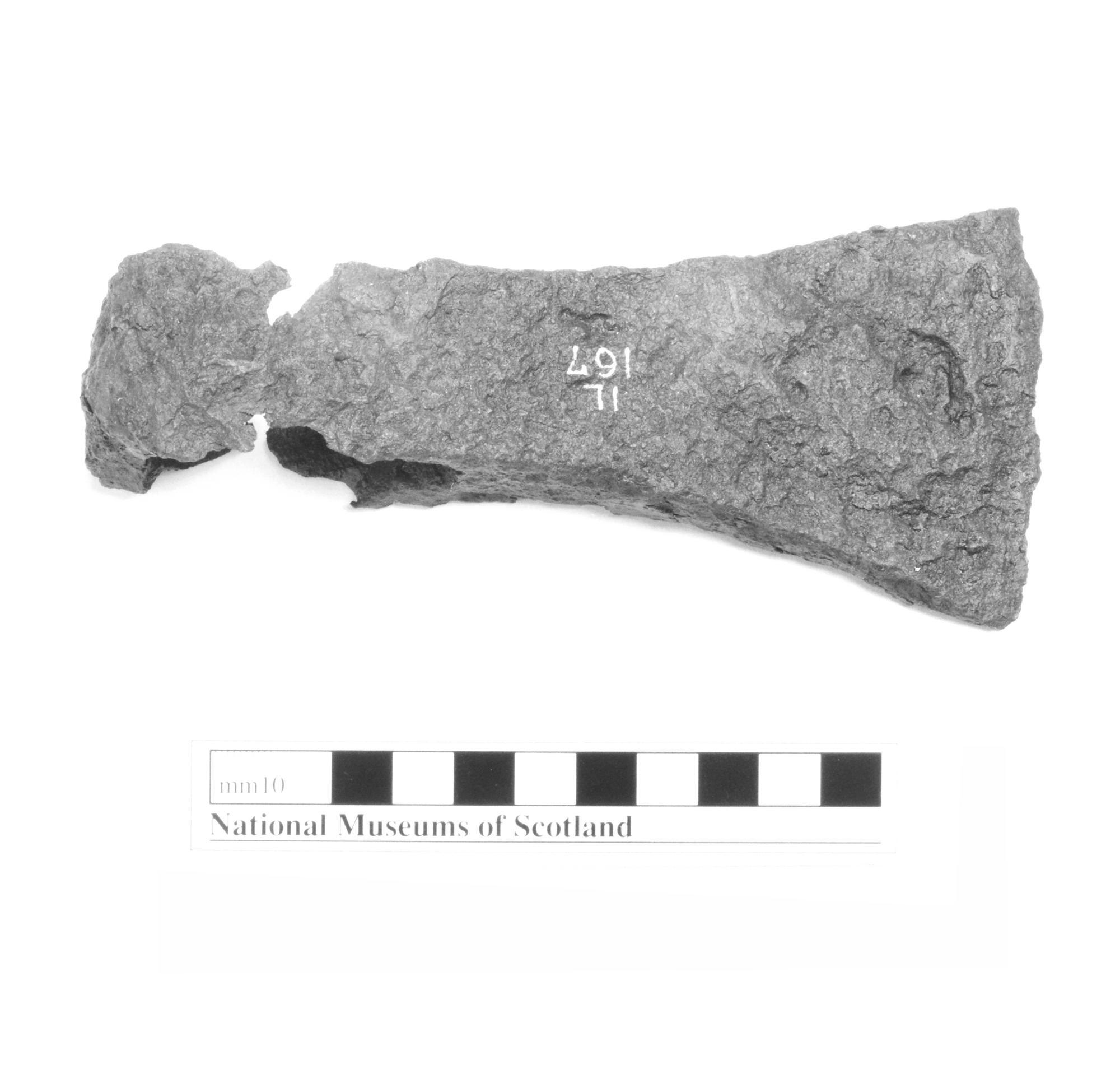 Image of Iron axe head of Viking type from Eigg, 9th - 12th century © National Museums Scotland
