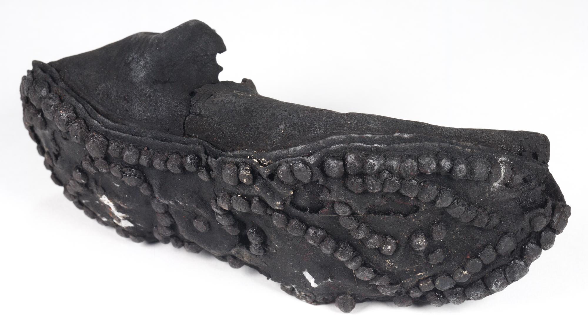 Image of Roman shoe or calceus of leather, with elaborate hobnail pattern, from the Roman site at Newstead, 80 - 180 AD © National Museums Scotland