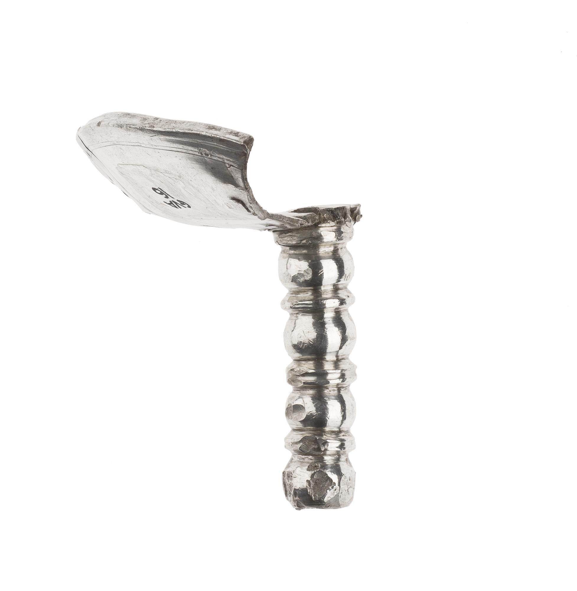 Image of Small portion of a silver wine cup with the greater part of the stem, from Traprain Law © National Museums Scotland