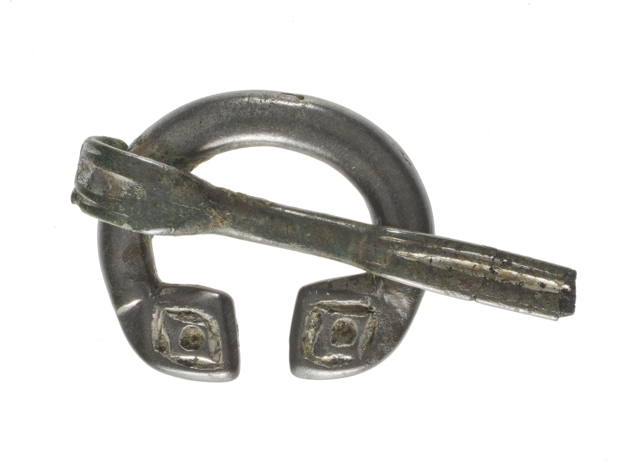 Image of Tinned bronze penannular brooch, from Castlehill, Ayrshire, 600 - 900 AD © National Museums Scotland