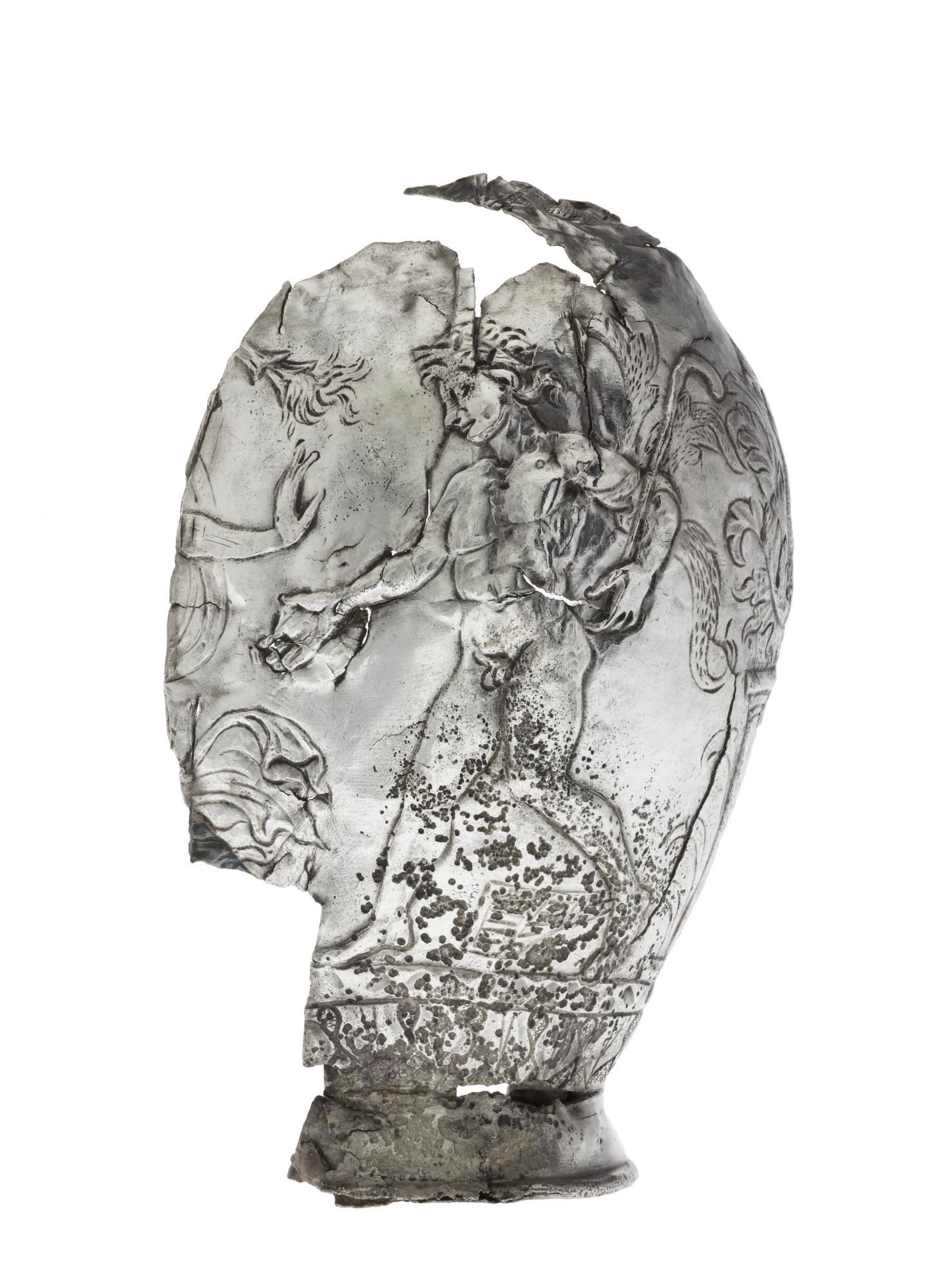 Image of Half of the body of a silver flask decorated with a figure of Pan, from Traprain Law, 410 - 425 AD © National Museums Scotland