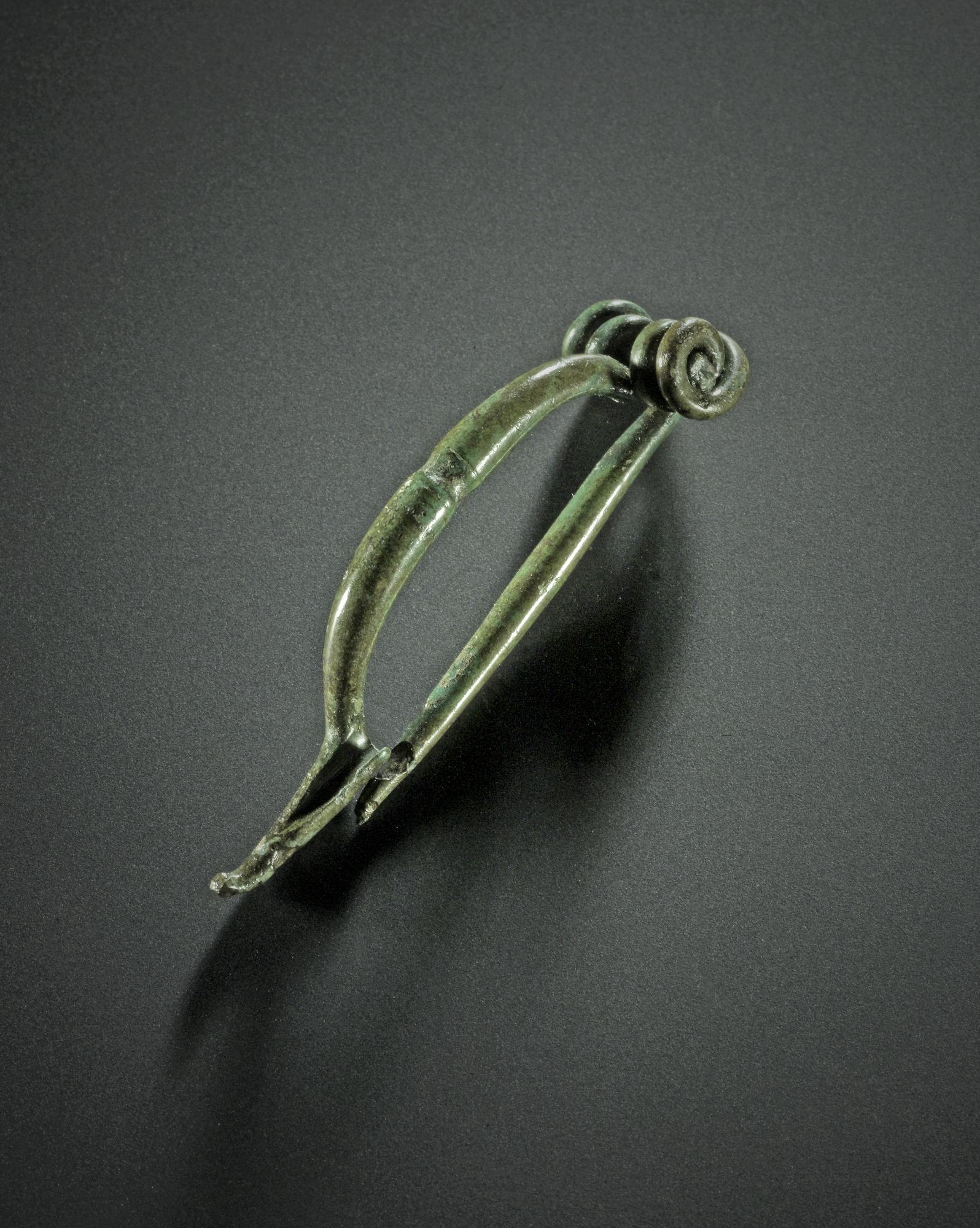 Image of La Tene brooch of bronze from Castle Law, Abernethy, Perthshire, 300 - 100 BC © National Museums Scotland