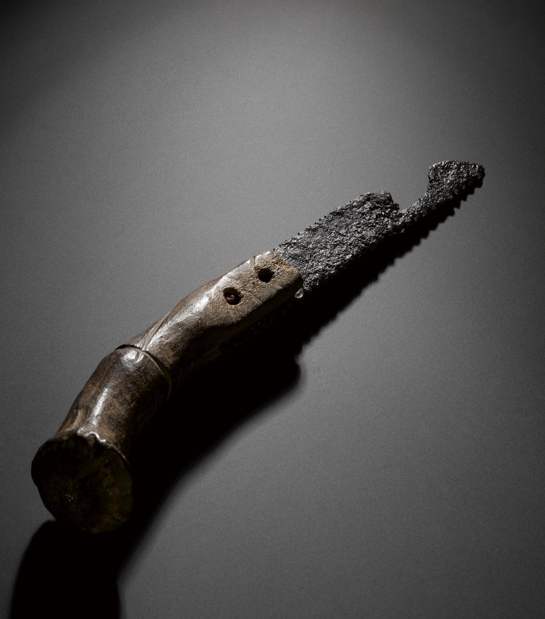 Image of Two-edged iron handsaw hafted in its original split antler handle, from the Roman site at Newstead, late 1st or 2nd century AD © National Museums Scotland