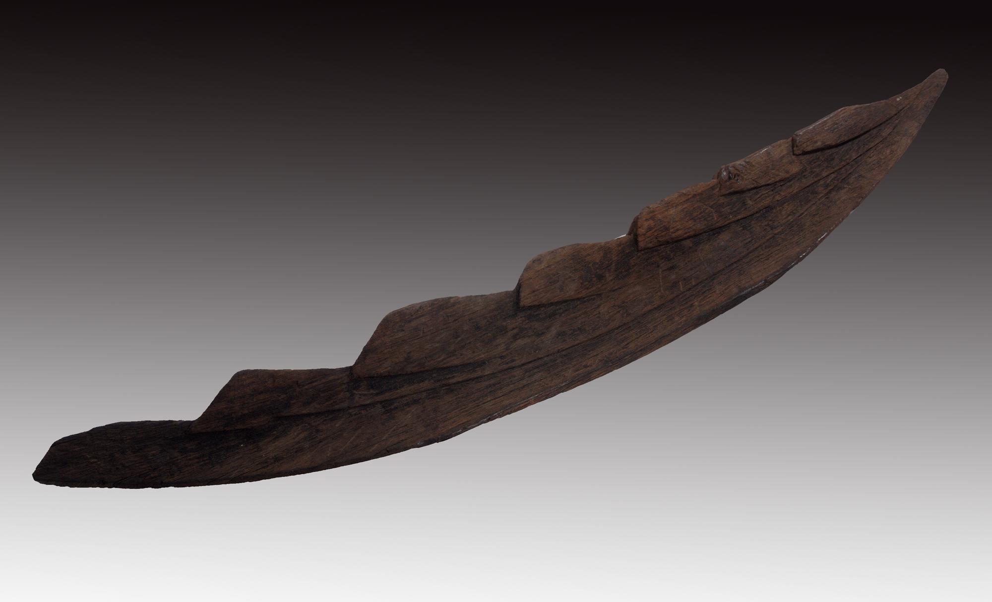 Image of Wooden stem post of oak, for a clinker-built boat of Viking type, from a bog at Laig, Isle of Eigg, 885 - 1035 AD © National Museums Scotland